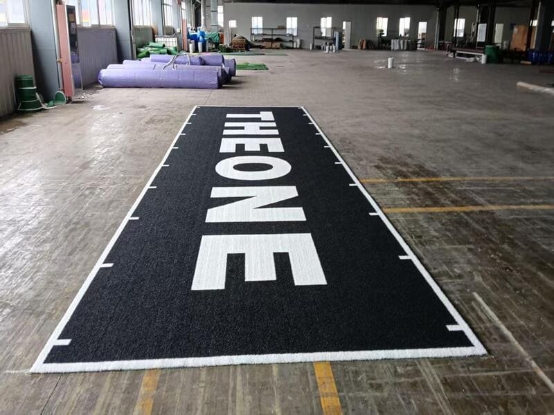 Athlete sprinting on a marked rubber gym track